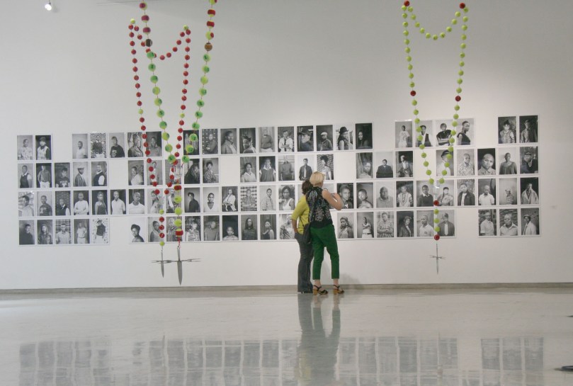 CRAFTY SYMBOLISM: Onlookers were drawn to the Faces and Faces wall, full of black and white photographs taken by visual artist Zanele Muholi. Photo: Pheladi Sethusa
