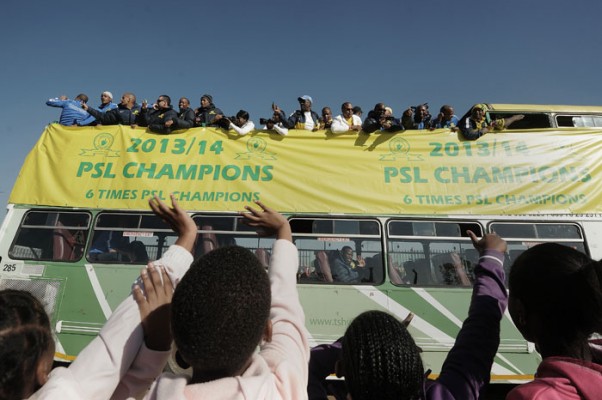 WE ARE THE CHAMPIONS. PSL champions Mamelodi Sundowns drive past children from Nellmapius Primary during their victory parade in Tshwane yesterday. Picture: Refilwe Modise.
